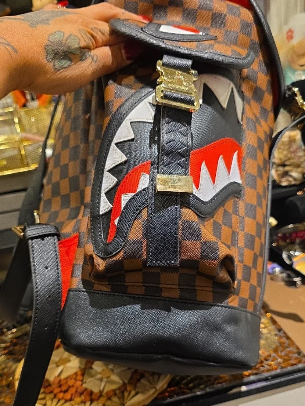 Sprayground Brown Checkerboard Backpack with Black Trim and Red Accent